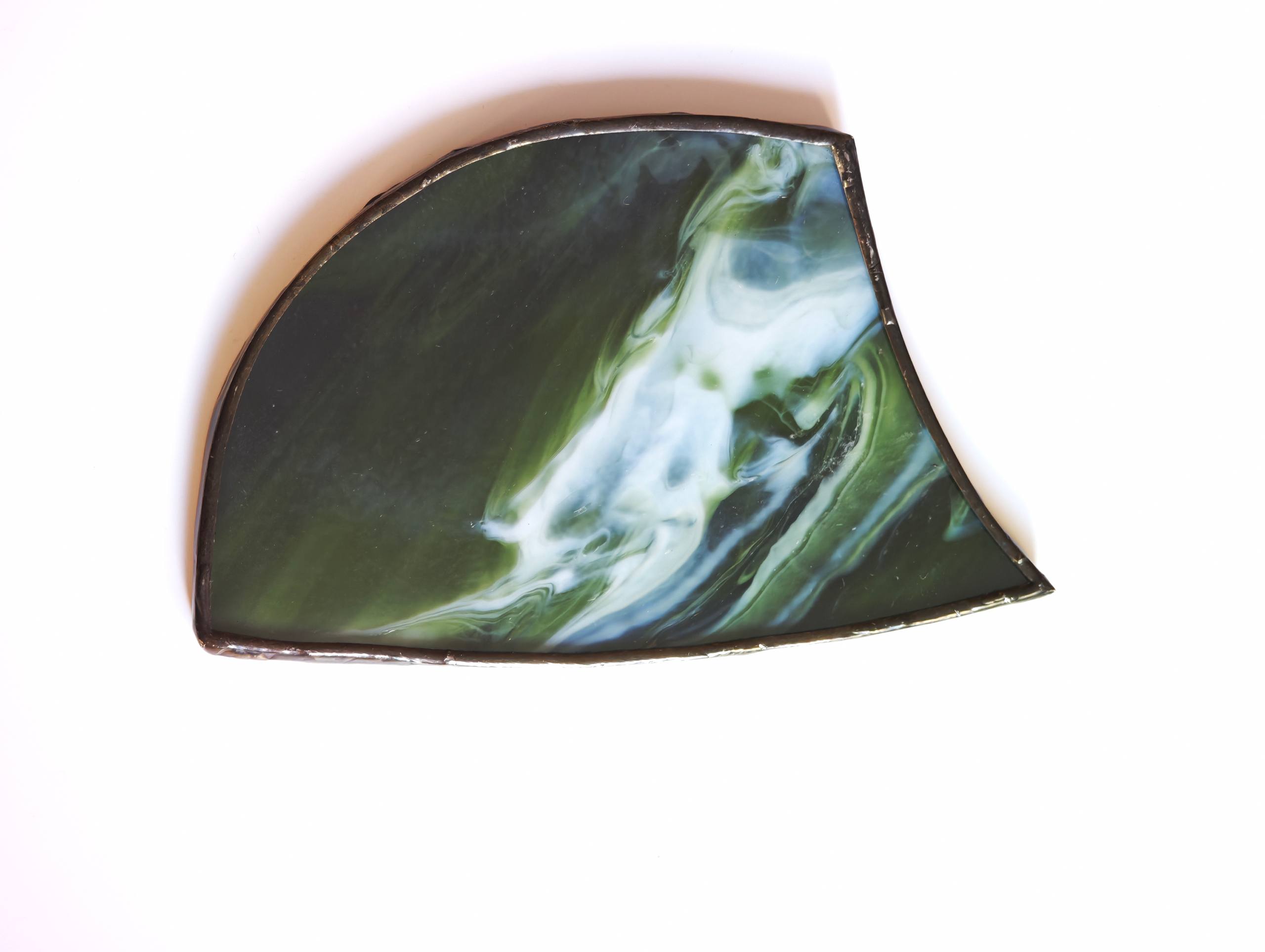 Green and white marbled glass piece