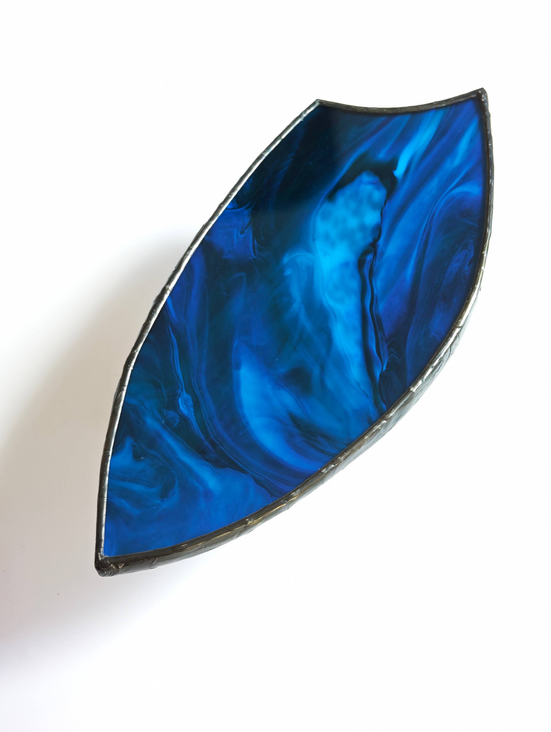 Bright blue marbled glass leaf