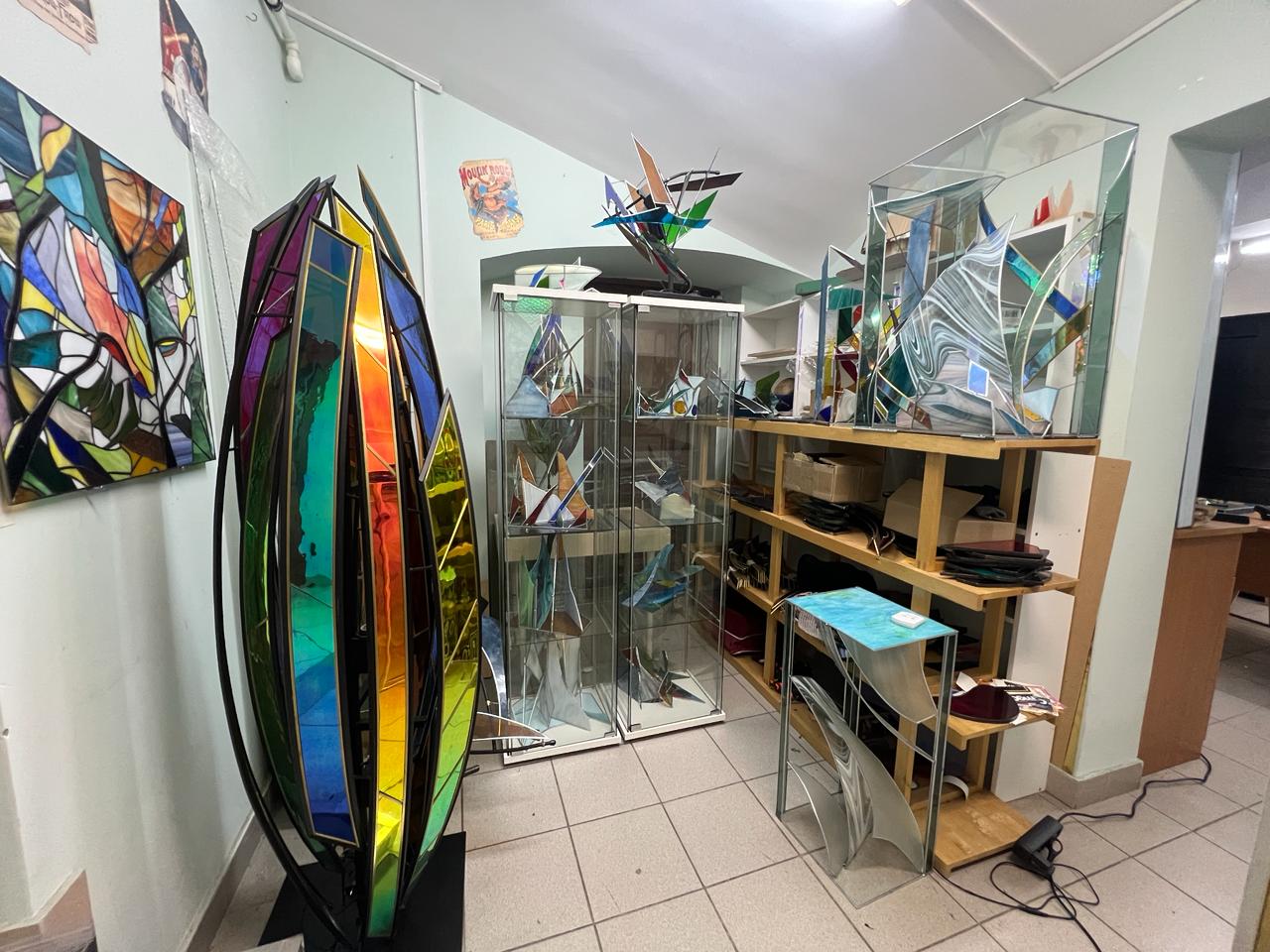 Display cases with finished glass pieces in the atelier